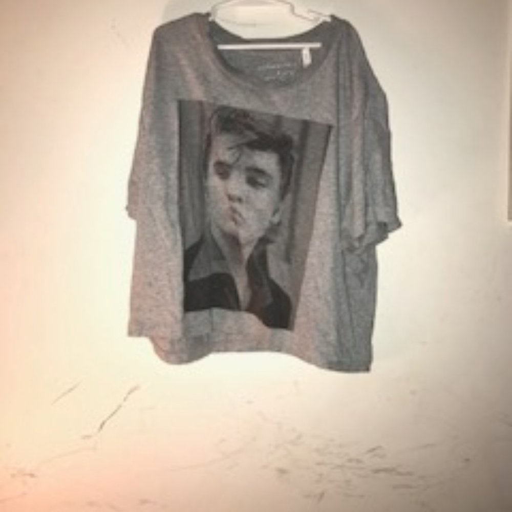 An Elvis Presely shirt  100% percent cotton